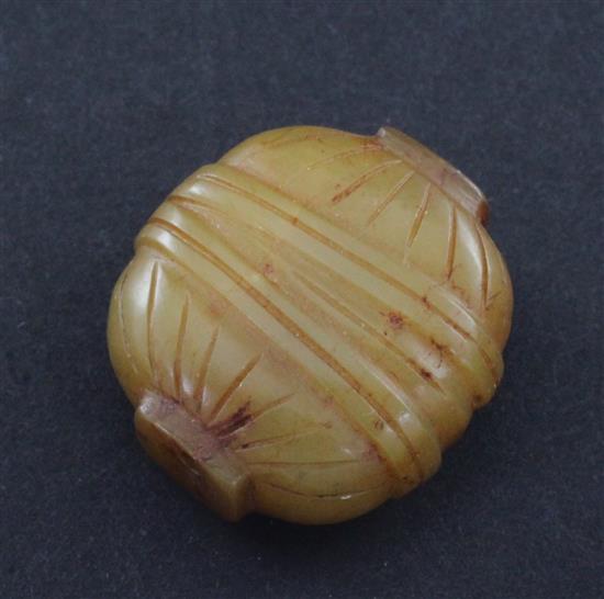 A Chinese yellow chalcedony bead, 19th century, 2.6cm